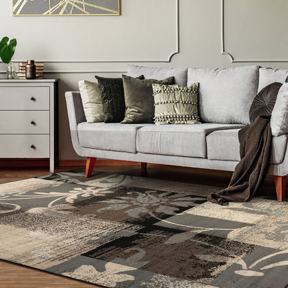 6' X 9' Beige And Gray Floral Power Loom Distressed Stain Resistant Area Rug