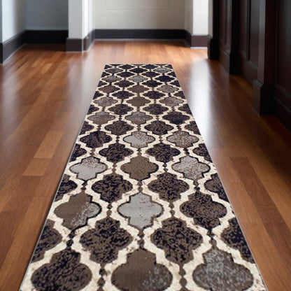 10' Brown Black And Ivory Quatrefoil Distressed Runner Rug