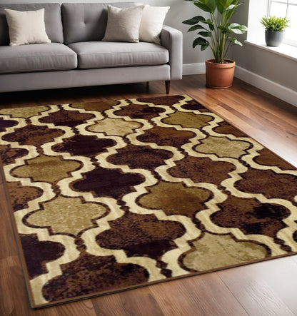 5' X 8' Coffee Beige And Black Quatrefoil Distressed Area Rug