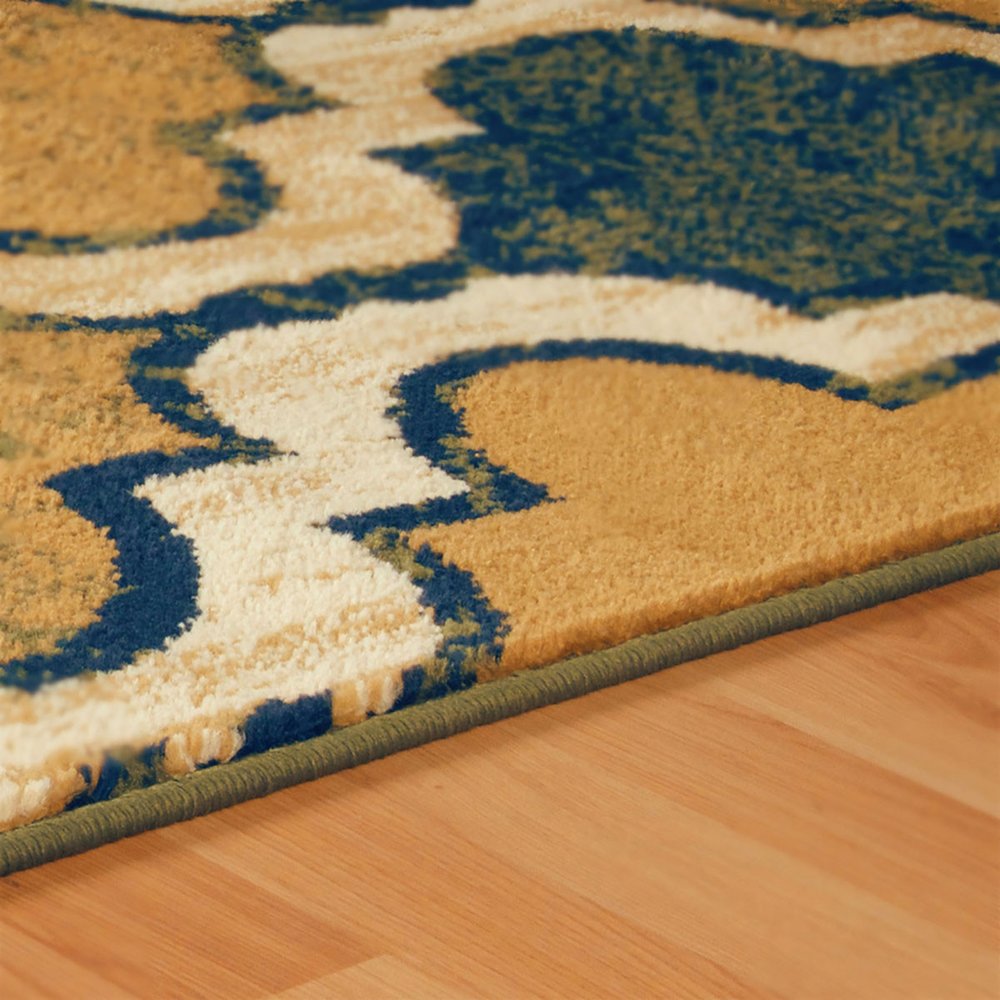 5' X 8' Green Brown And Ivory Quatrefoil Distressed Area Rug