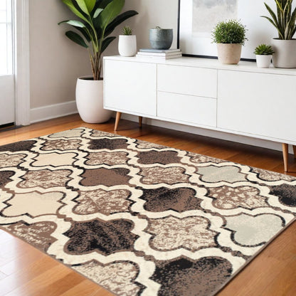 5' X 8' Ivory Brown And Black Quatrefoil Distressed Area Rug