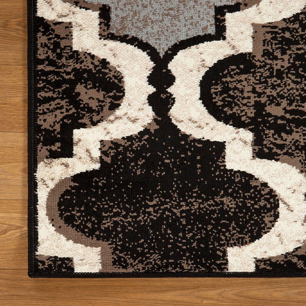 6' X 9' Brown Black And Ivory Quatrefoil Distressed Area Rug