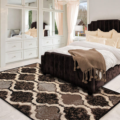 6' X 9' Brown Black And Ivory Quatrefoil Distressed Area Rug