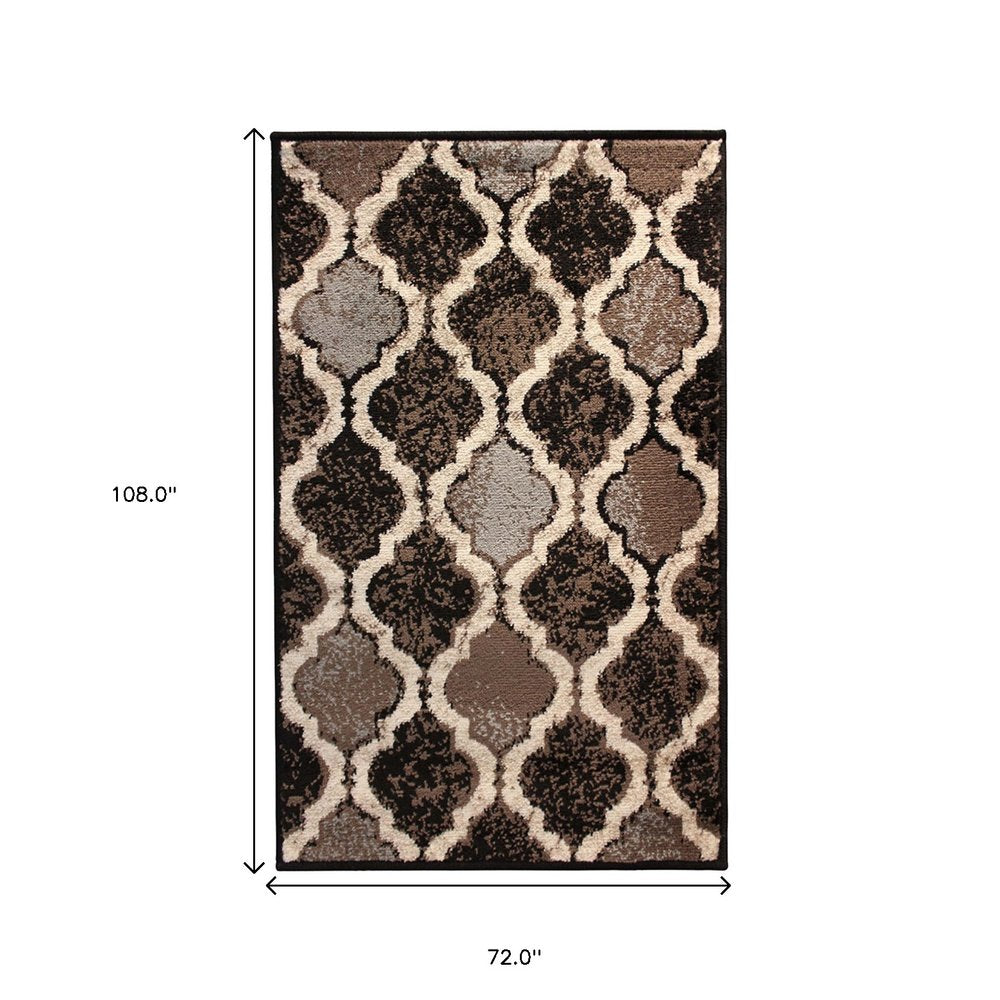 6' X 9' Brown Black And Ivory Quatrefoil Distressed Area Rug