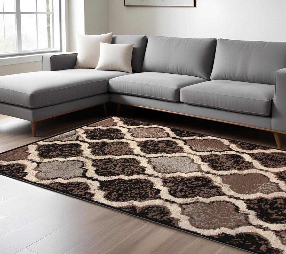 6' X 9' Brown Black And Ivory Quatrefoil Distressed Area Rug