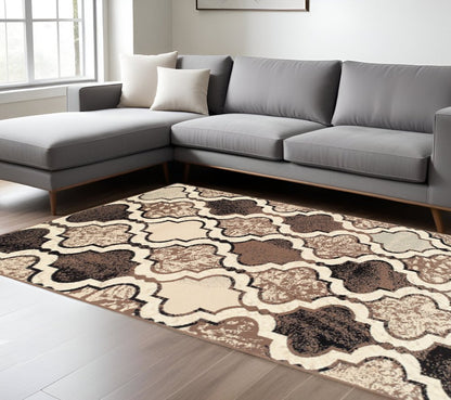 7' X 9' Ivory Brown And Black Quatrefoil Distressed Area Rug