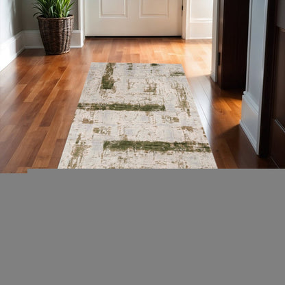 10' Green and Ivory Abstract Power Loom Distressed Runner Rug