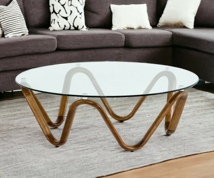 45" Clear And Brown Glass And Solid Wood Round Coffee Table