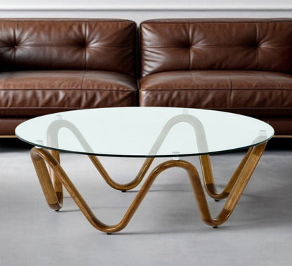 45" Clear and Brown Glass And Solid Wood Round Abstract Coffee Table