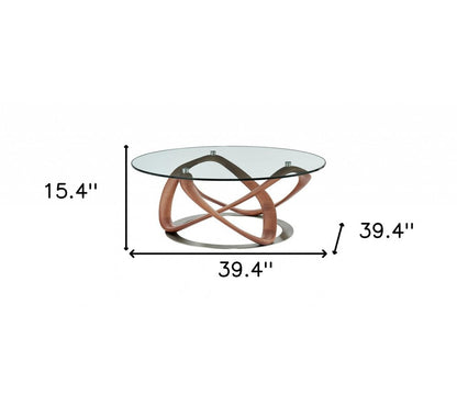 39" Clear and Brown Glass And Solid Wood Round Abstract Coffee Table