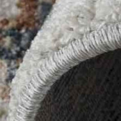 5' X 8' Beige and Blue Abstract Power Loom Area Rug