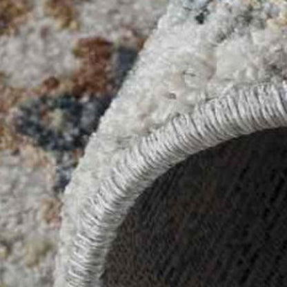 5' X 8' Beige and Blue Abstract Power Loom Area Rug