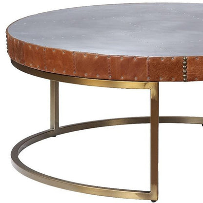 36" Brown And Silver Leather And Metal Round Coffee Table