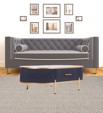 47" White And Gold Stone And Stainless Steel Oval Coffee Table With Drawer