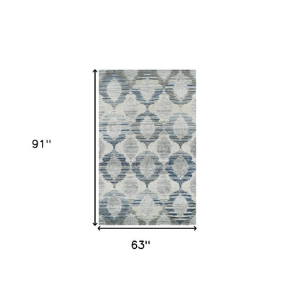 5' X 8' Blue and Ivory Geometric Area Rug