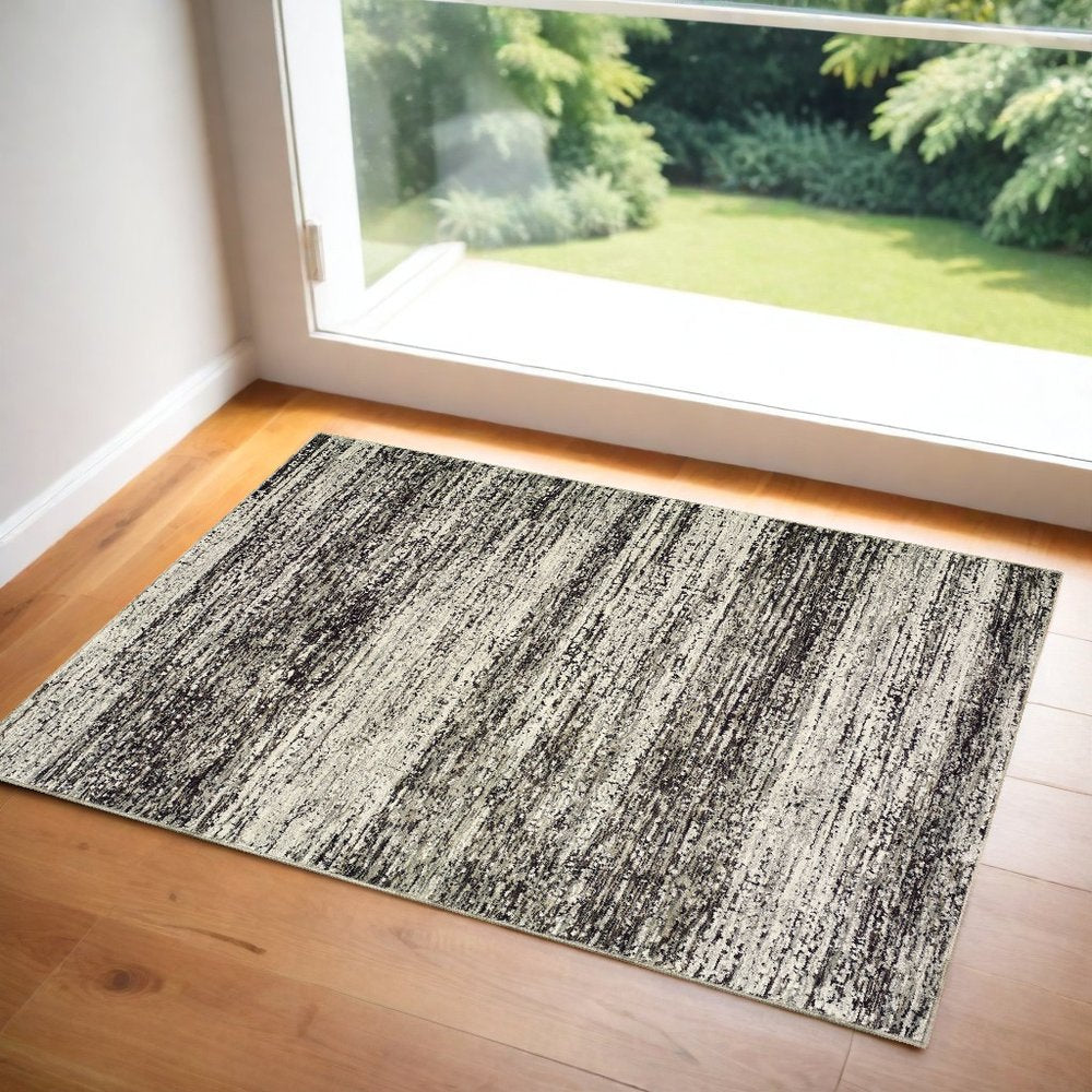 2' X 3' Gray and Ivory Abstract Power Loom Area Rug