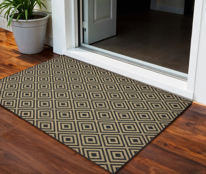 2' X 4' Black and Tan Geometric Stain Resistant Indoor Outdoor Area Rug