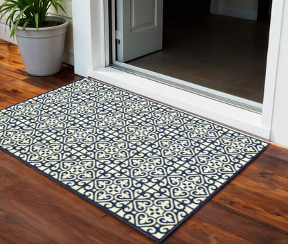2' X 4' Ivory and Blue Geometric Stain Resistant Indoor Outdoor Area Rug