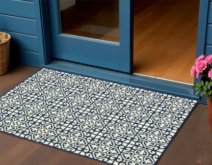2' X 4' Ivory and Blue Geometric Stain Resistant Indoor Outdoor Area Rug
