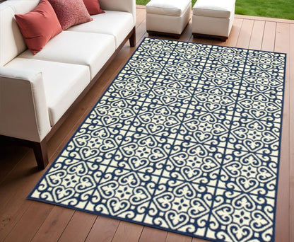 4' X 6' Ivory and Blue Geometric Stain Resistant Indoor Outdoor Area Rug