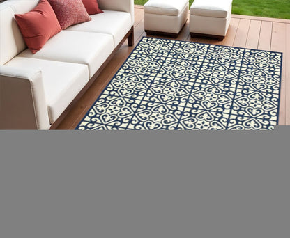4' X 6' Ivory and Blue Geometric Stain Resistant Indoor Outdoor Area Rug