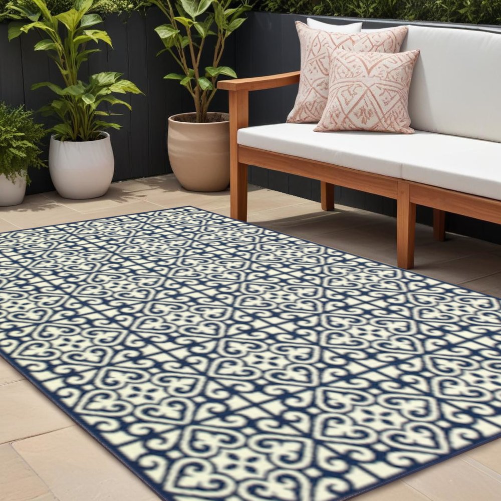 8' X 11' Ivory and Blue Geometric Stain Resistant Indoor Outdoor Area Rug