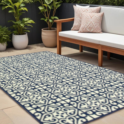 8' X 11' Ivory and Blue Geometric Stain Resistant Indoor Outdoor Area Rug