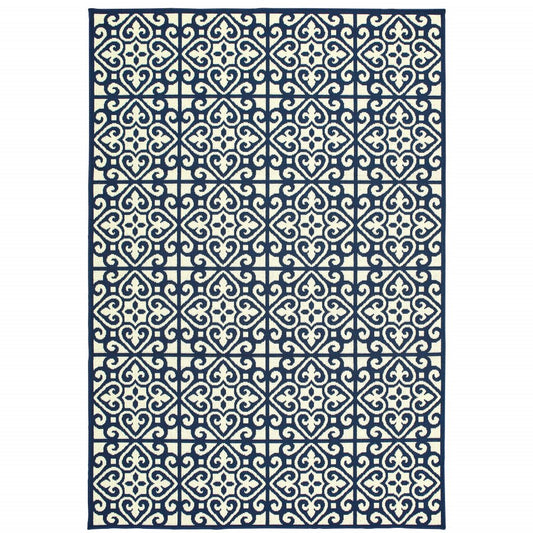 9' X 13' Ivory and Blue Geometric Stain Resistant Indoor Outdoor Area Rug
