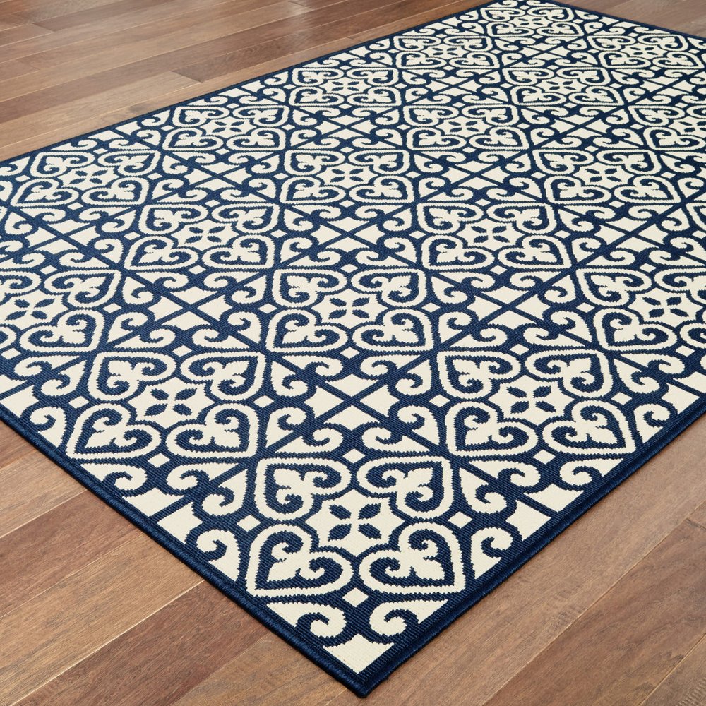 9' X 13' Ivory and Blue Geometric Stain Resistant Indoor Outdoor Area Rug