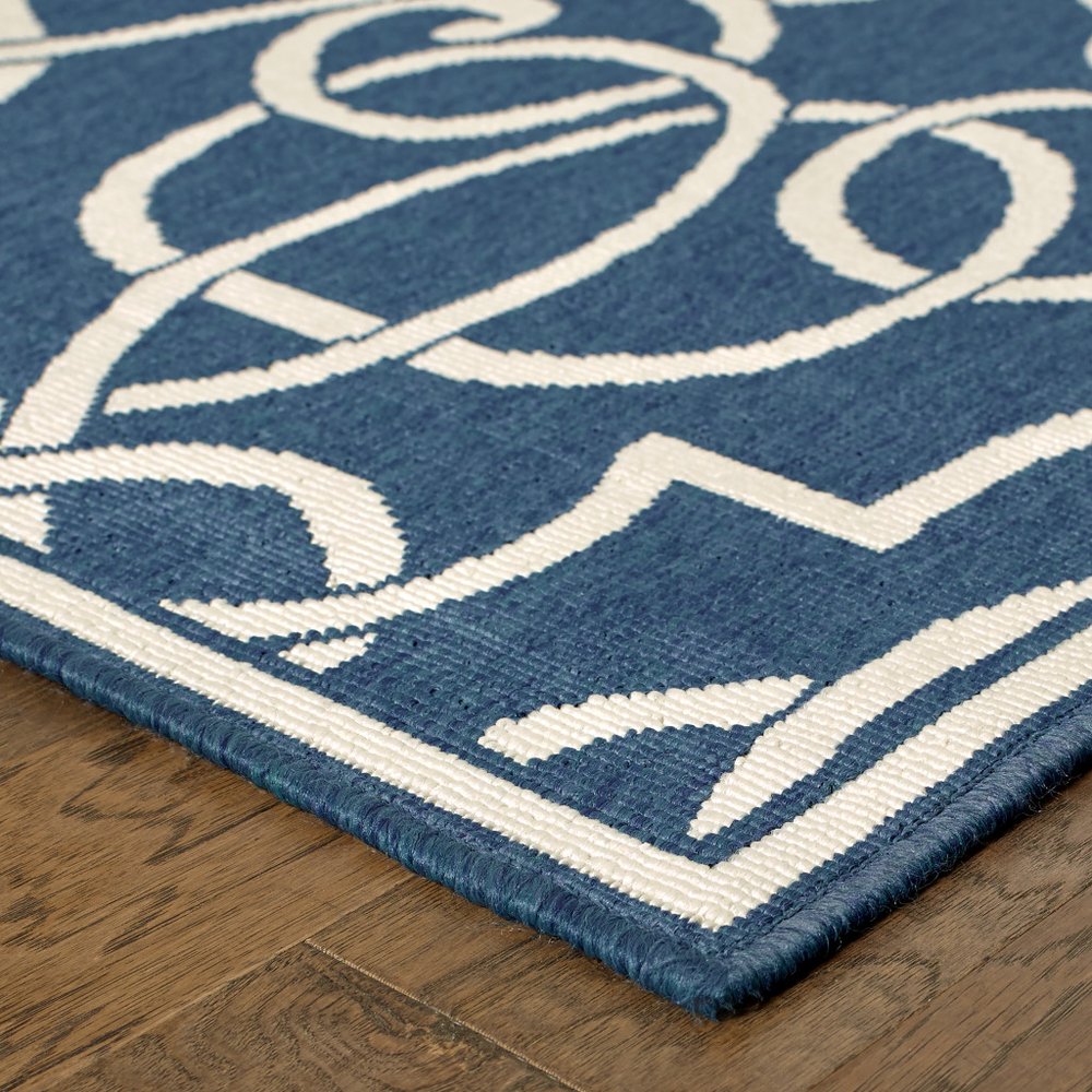 2' X 8' Blue and Ivory Geometric Stain Resistant Indoor Outdoor Area Rug