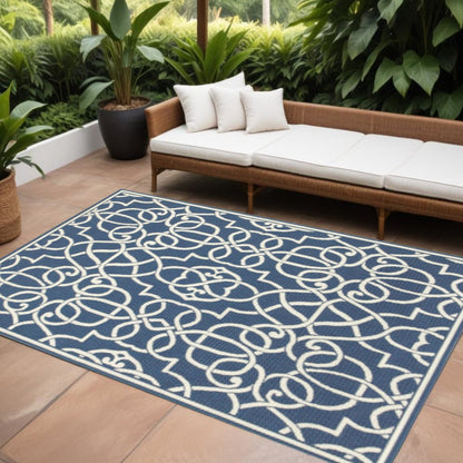 7' X 10' Blue and Ivory Geometric Stain Resistant Indoor Outdoor Area Rug