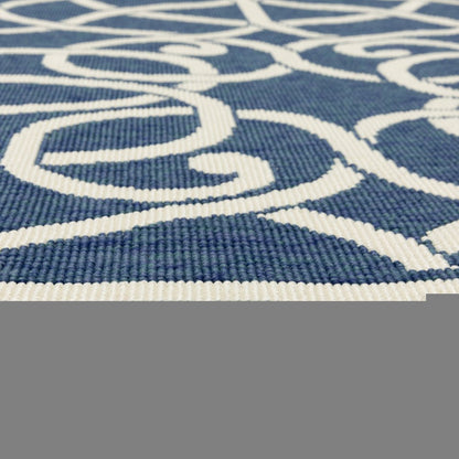 7' X 10' Blue and Ivory Geometric Stain Resistant Indoor Outdoor Area Rug