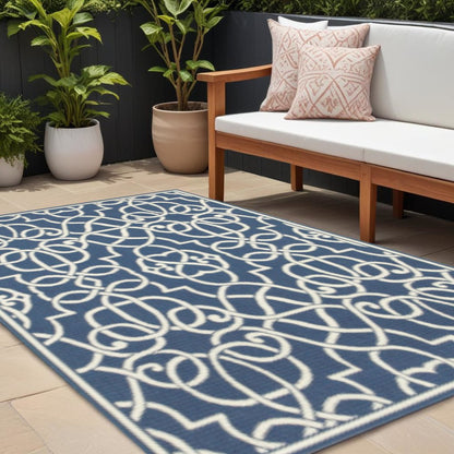 8' X 11' Blue and Ivory Geometric Stain Resistant Indoor Outdoor Area Rug
