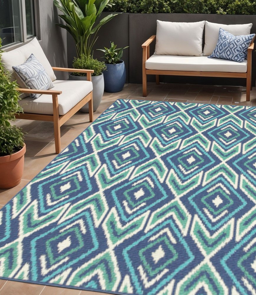 5' X 8' Blue and Ivory Geometric Stain Resistant Indoor Outdoor Area Rug