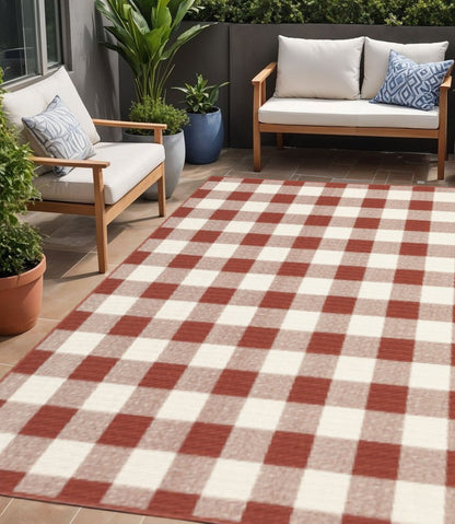 5' X 8' Red and Ivory Geometric Stain Resistant Indoor Outdoor Area Rug