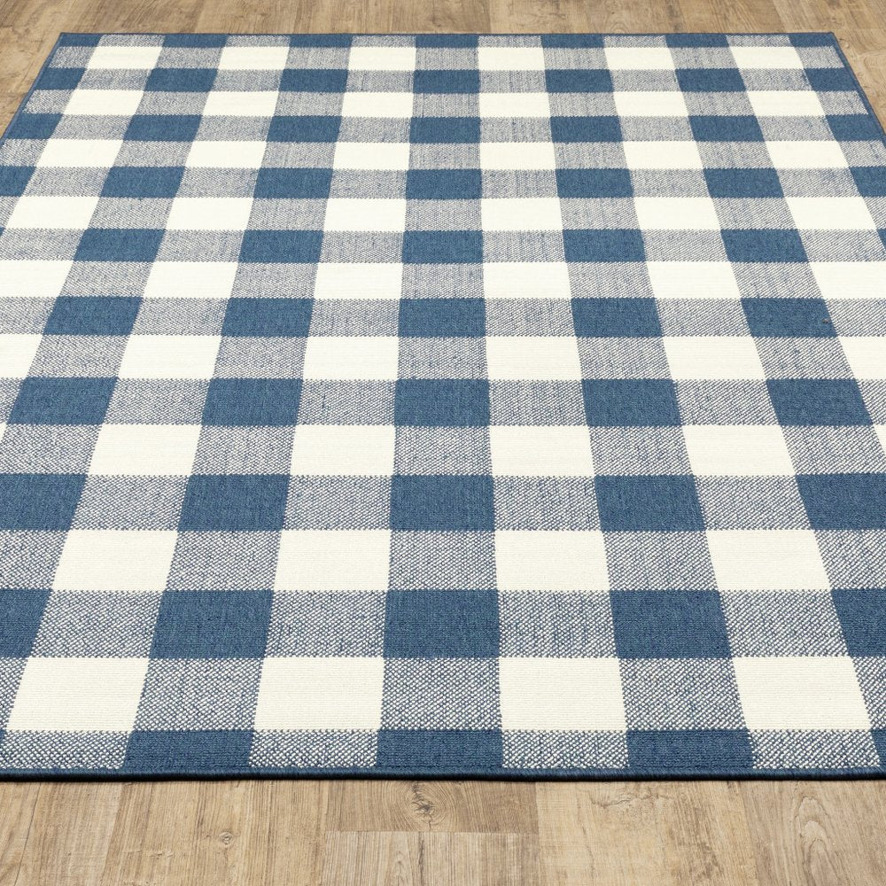5' X 8' Blue and Ivory Geometric Stain Resistant Indoor Outdoor Area Rug