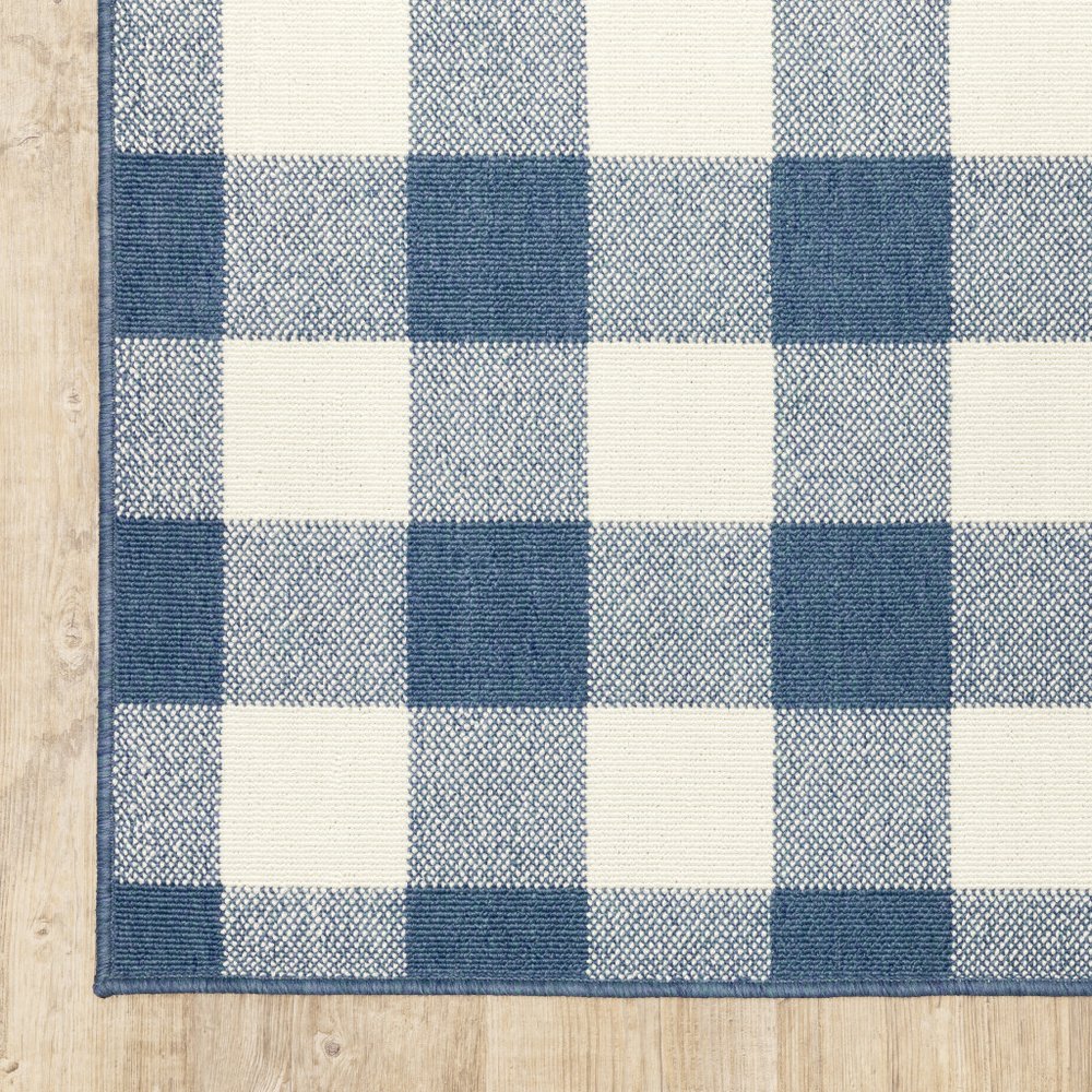 5' X 8' Blue and Ivory Geometric Stain Resistant Indoor Outdoor Area Rug