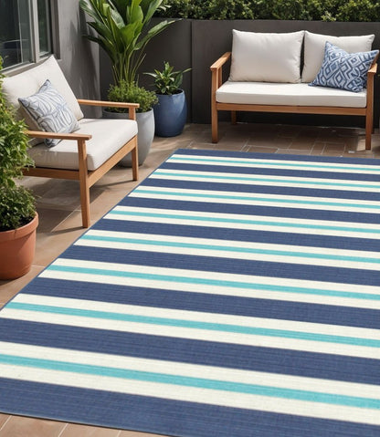 5' X 8' Blue and Ivory Geometric Stain Resistant Indoor Outdoor Area Rug