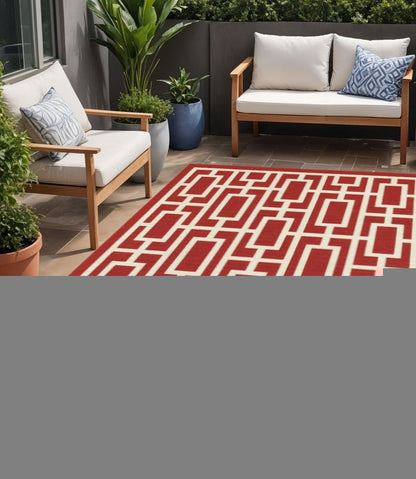 5' X 8' Red and Ivory Geometric Stain Resistant Indoor Outdoor Area Rug