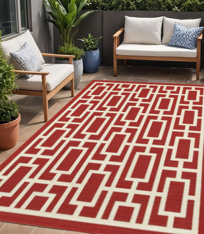 5' X 8' Red and Ivory Geometric Stain Resistant Indoor Outdoor Area Rug