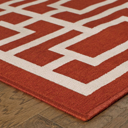 7' X 10' Red and Ivory Geometric Stain Resistant Indoor Outdoor Area Rug