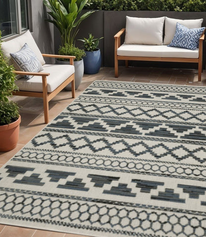 5' X 7' Blue and Beige Geometric Stain Resistant Indoor Outdoor Area Rug