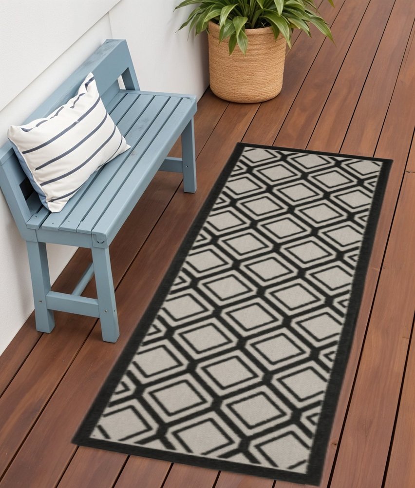 2' X 7' Beige and Black Geometric Stain Resistant Indoor Outdoor Area Rug