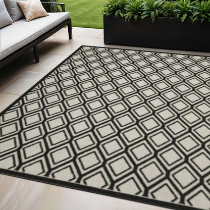 5' X 7' Beige and Black Geometric Stain Resistant Indoor Outdoor Area Rug
