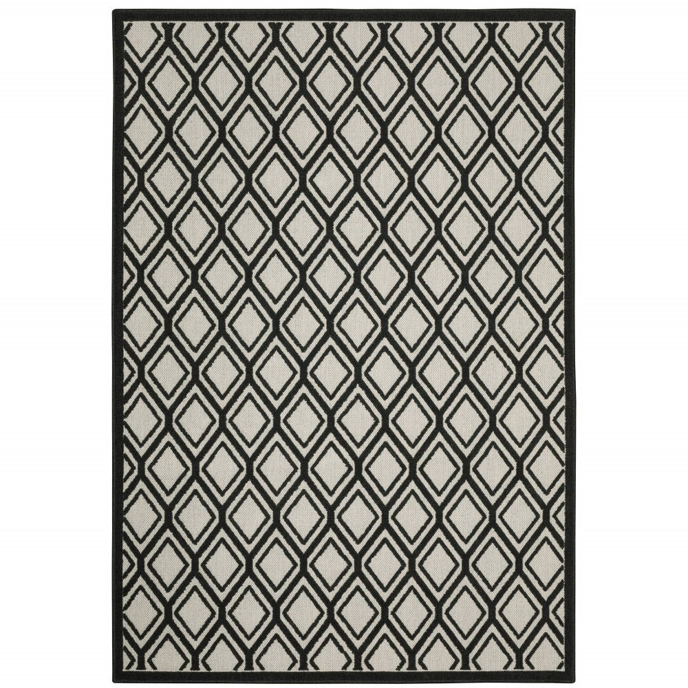 7' X 9' Beige and Black Geometric Stain Resistant Indoor Outdoor Area Rug