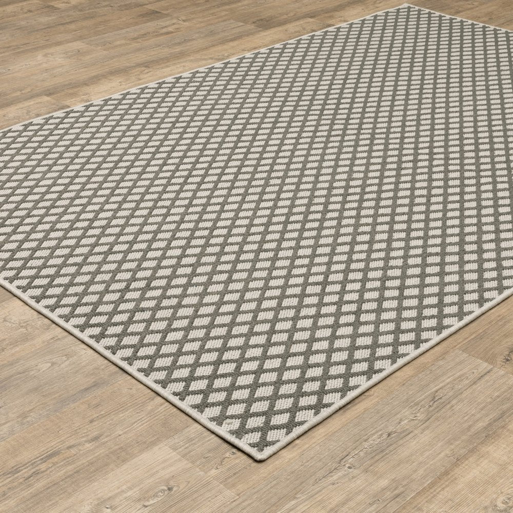 5' X 7' Beige Geometric Stain Resistant Indoor Outdoor Area Rug