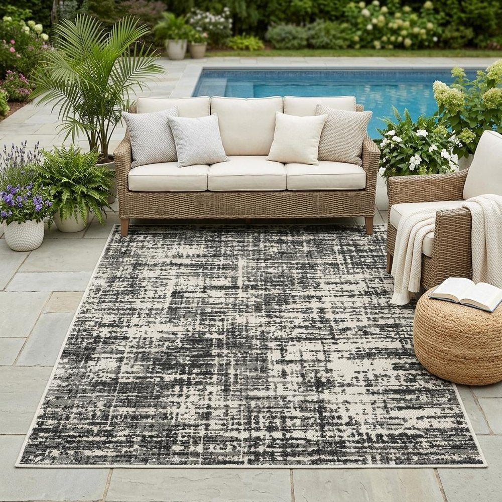 5' X 7' Beige and Black Abstract Stain Resistant Indoor Outdoor Area Rug