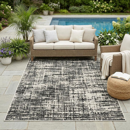 5' X 7' Beige and Black Abstract Stain Resistant Indoor Outdoor Area Rug