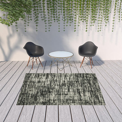 7' X 9' Beige and Black Abstract Stain Resistant Indoor Outdoor Area Rug