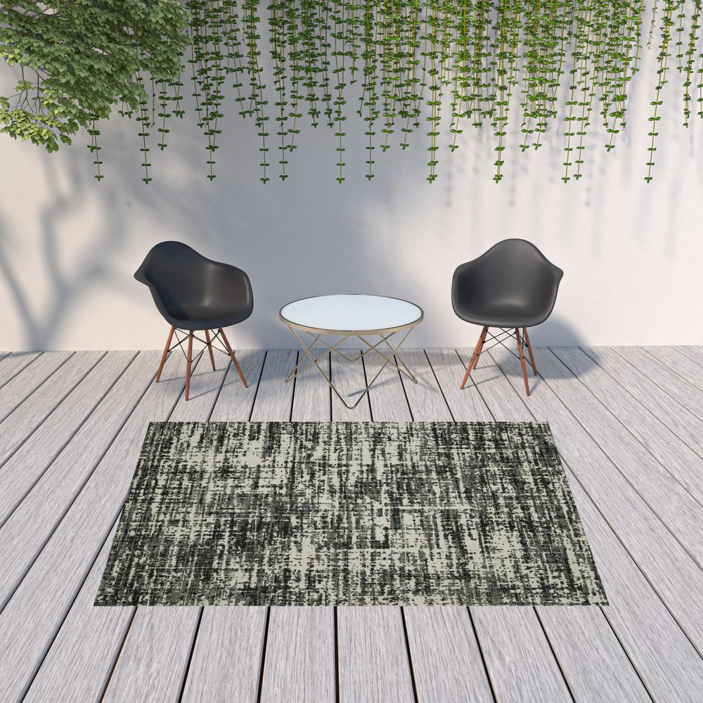 7' X 9' Beige and Black Abstract Stain Resistant Indoor Outdoor Area Rug